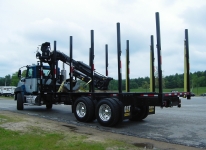 CAT Truck with log body attachment