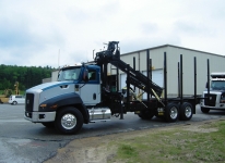 CAT Truck with log body attachment